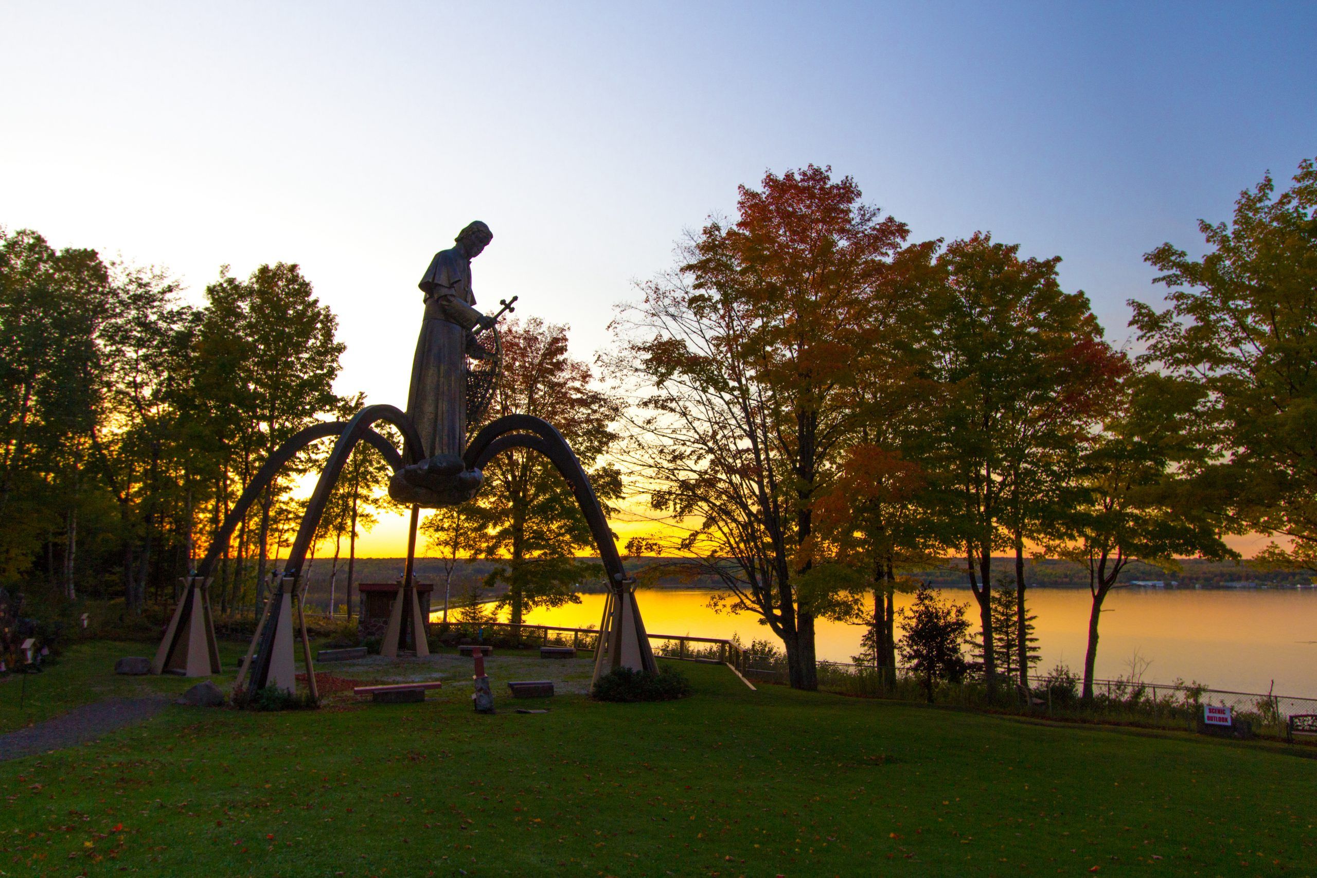 Bishop Baraga Shrine at sunset. The statue is over six stories tall and overlooks the Keweenaw Bay in the Upper Peninsula